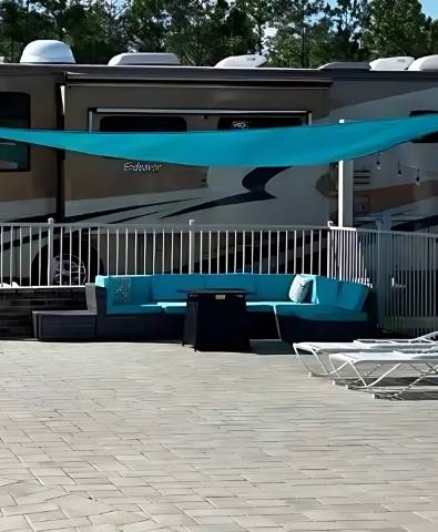 Premium pull-through double RV site with slide-outs extended, 110 feet by 22 feet, at Sugar Sands RV Resort.